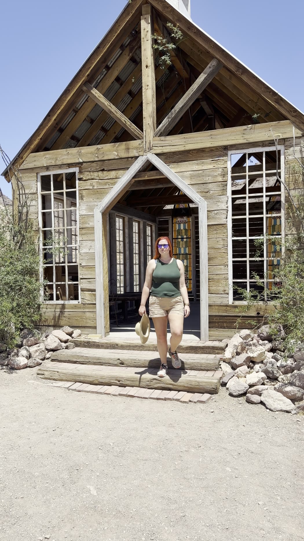 Jenna stepping out of the wooden chapel at Nelson Ghost Town
