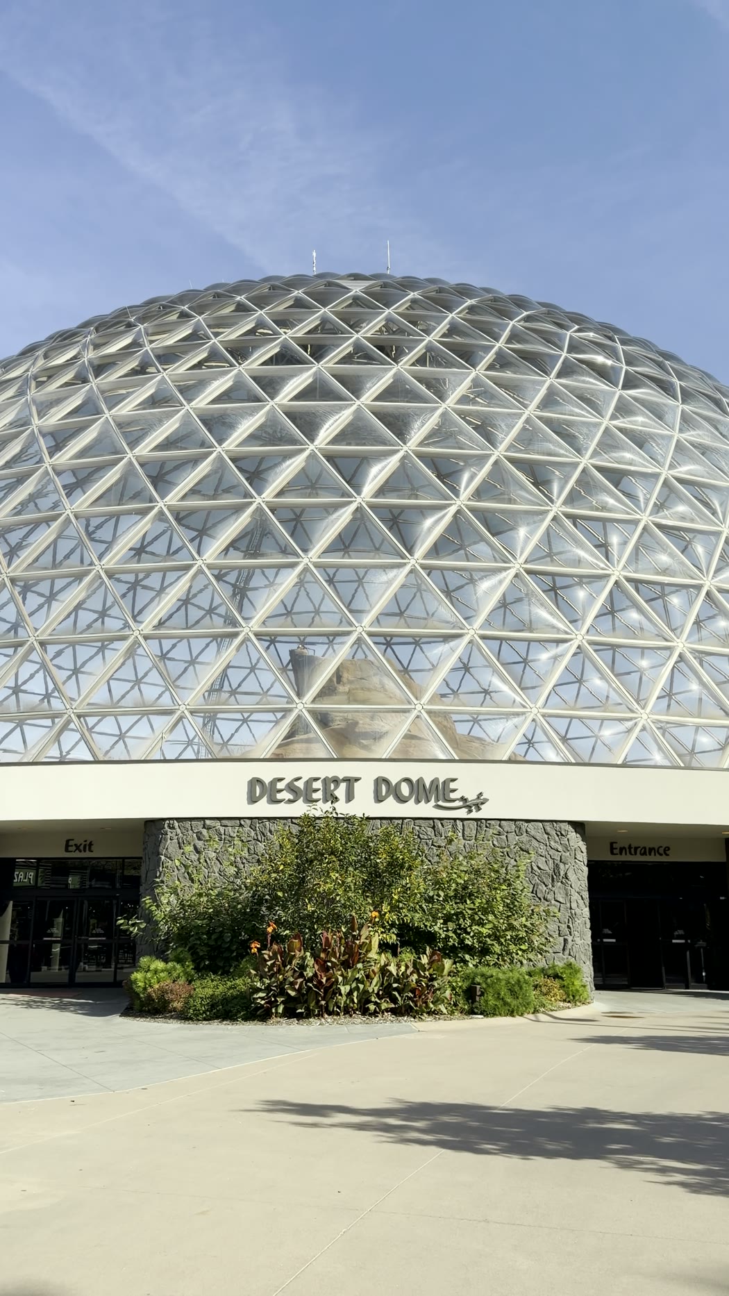 The glass Desert Dome against a clear blue sky