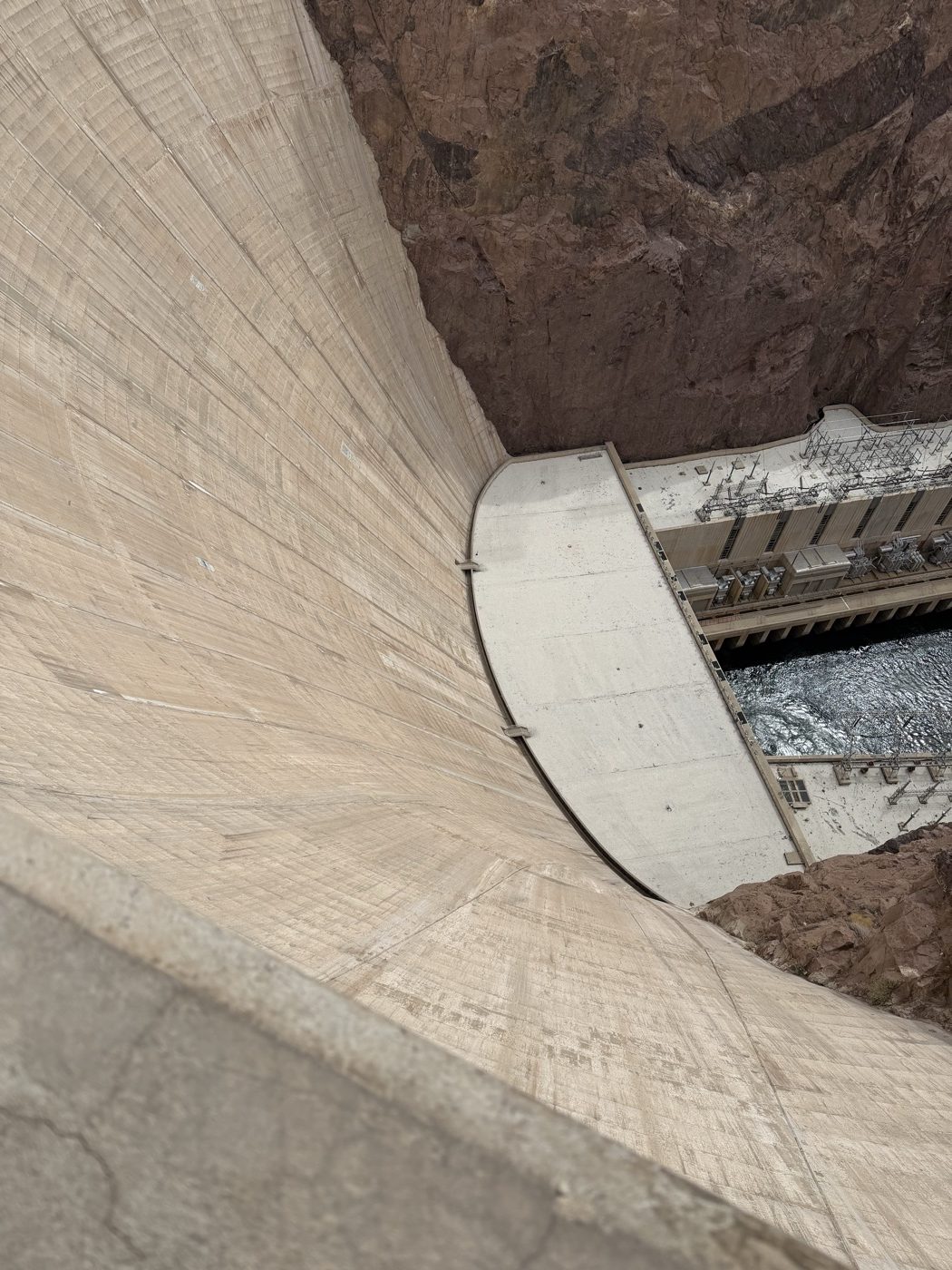 Looking straight down the face of the dam to the power plant at the bottom