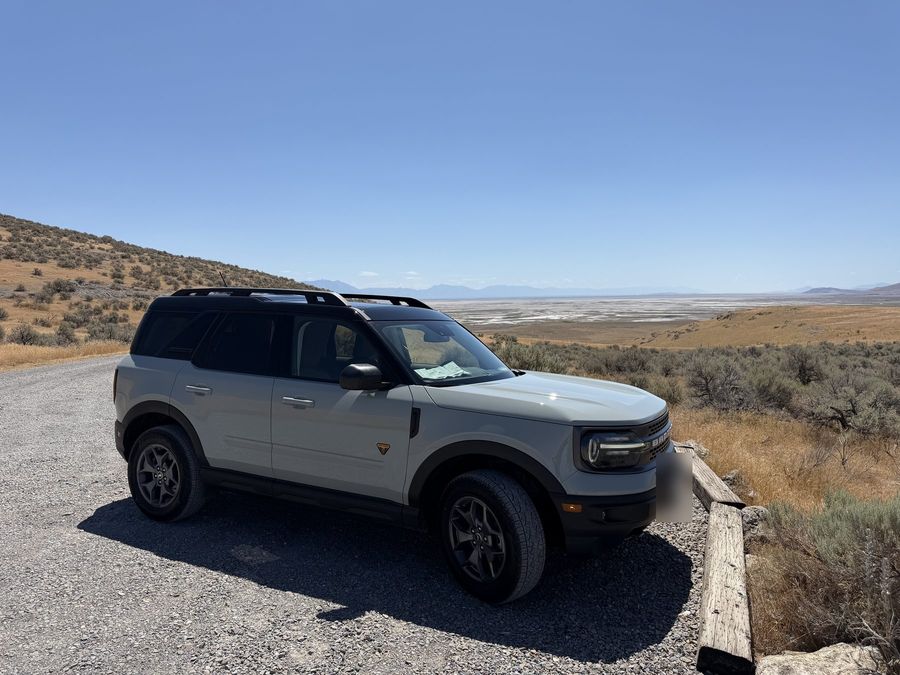 Daisy parked above a wide valley at Golden Spike