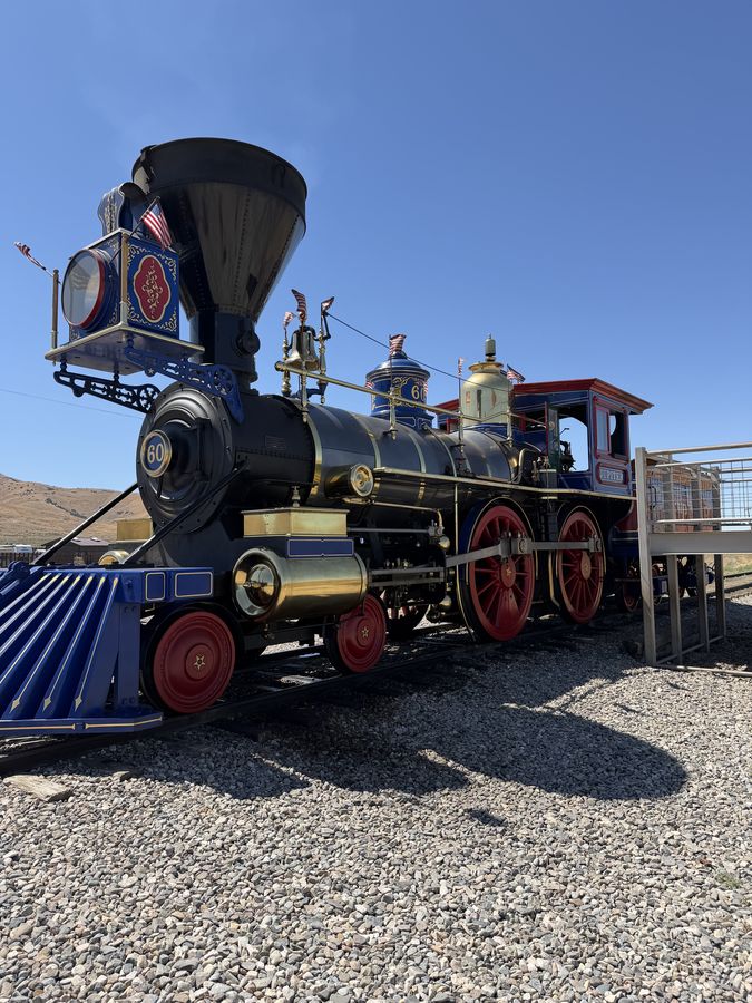 The Jupiter locomotive from the front, blue and brass with red wheels