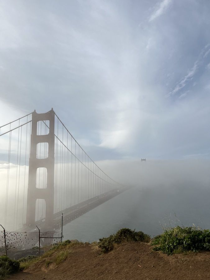 The Golden Gate Bridge disappearing into fog