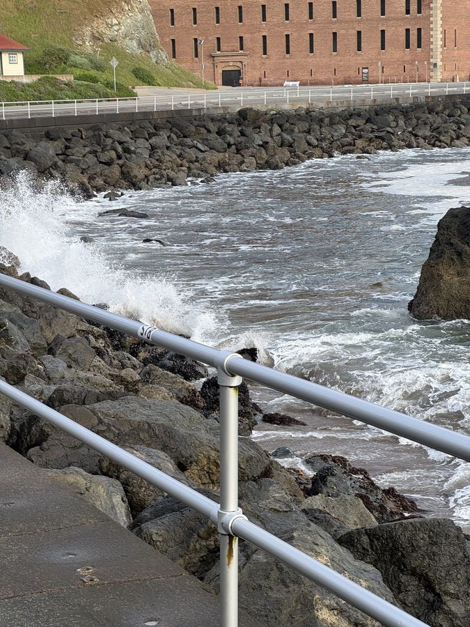 A wave breaking over a seawall