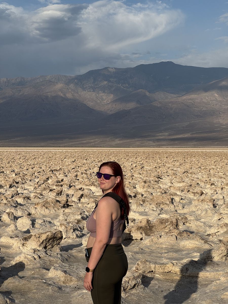 Eroded desert badlands under a hard midday sun