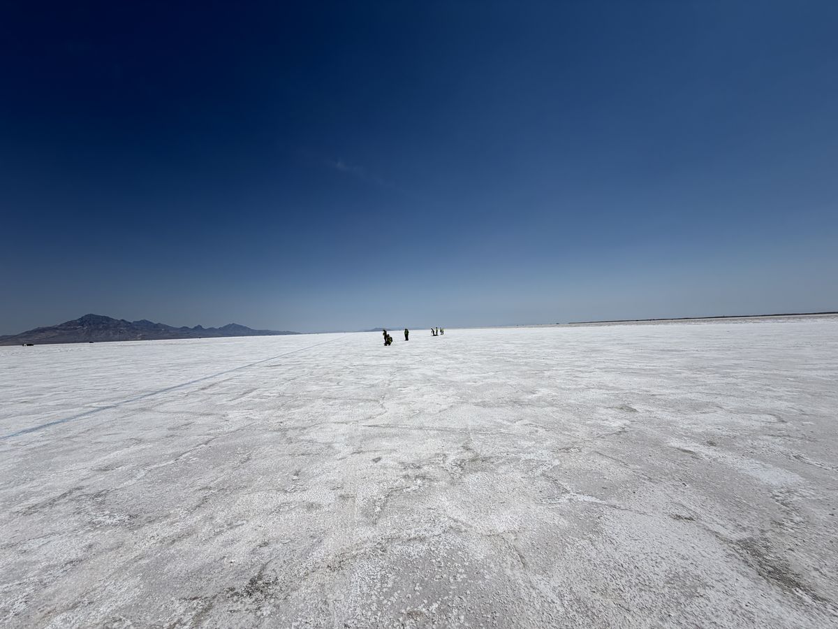 The Bonneville Salt Flats running out flat to distant mountains
